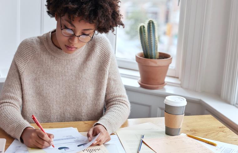 Skincare professional looking at notes. It Takes a Village: Skincare Professions