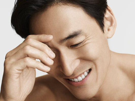 Asian man smiling - good skin - Codex Beauty